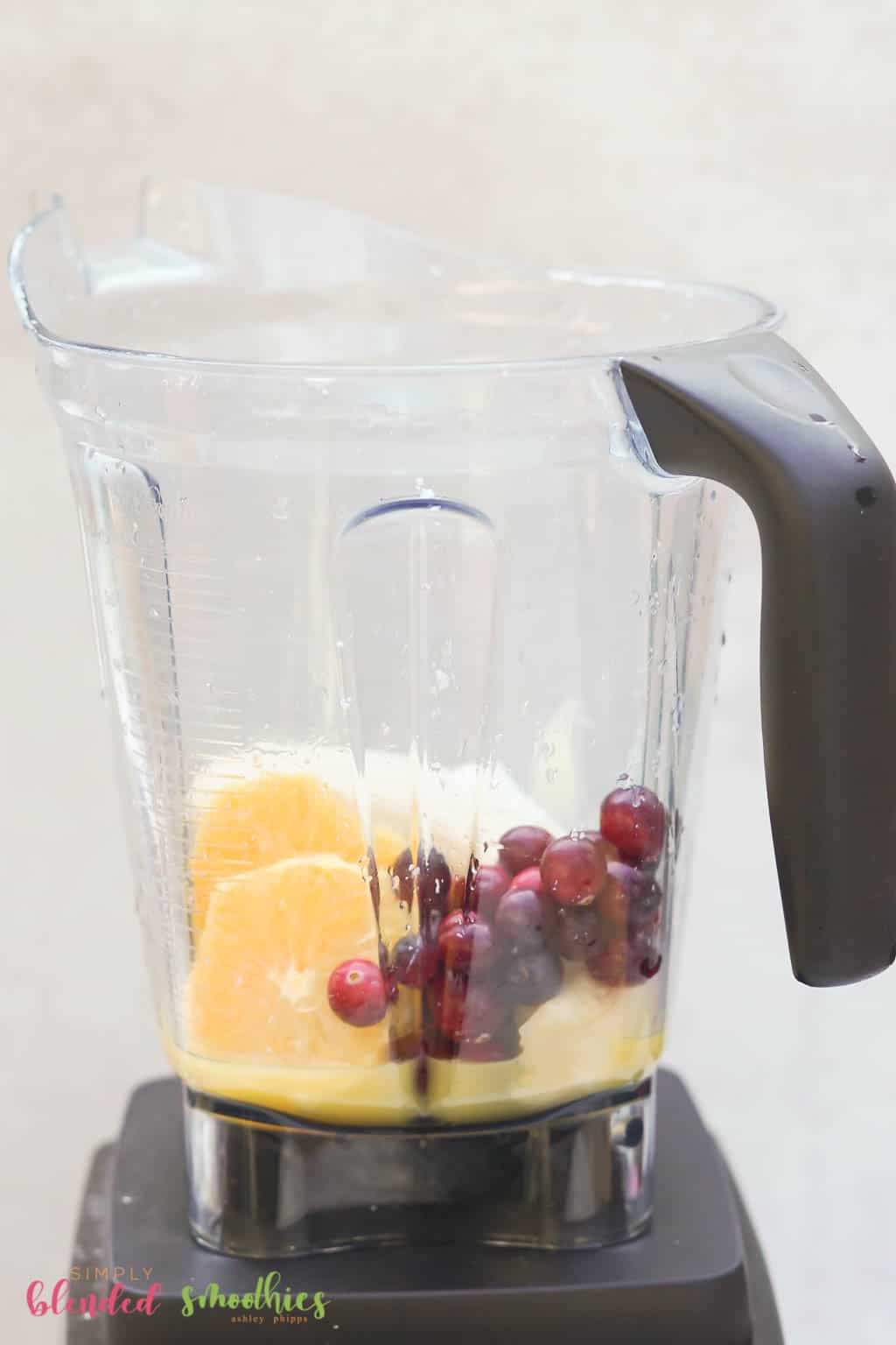 Ingredients For A Cranberry Orange Smoothie In A Blender
