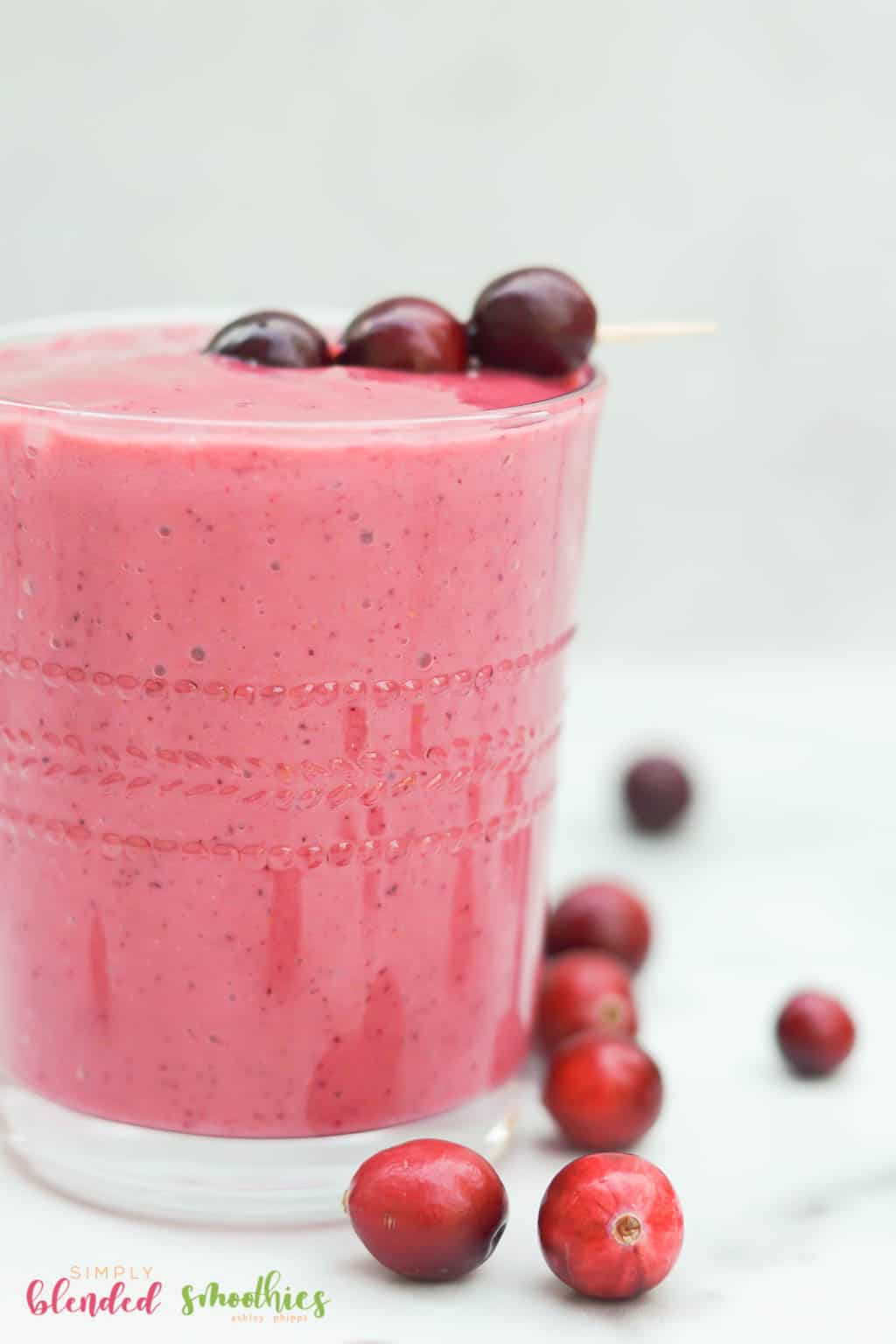 Cranberry Smoothie Close Up Photo With Fresh Cranberries As Garnish