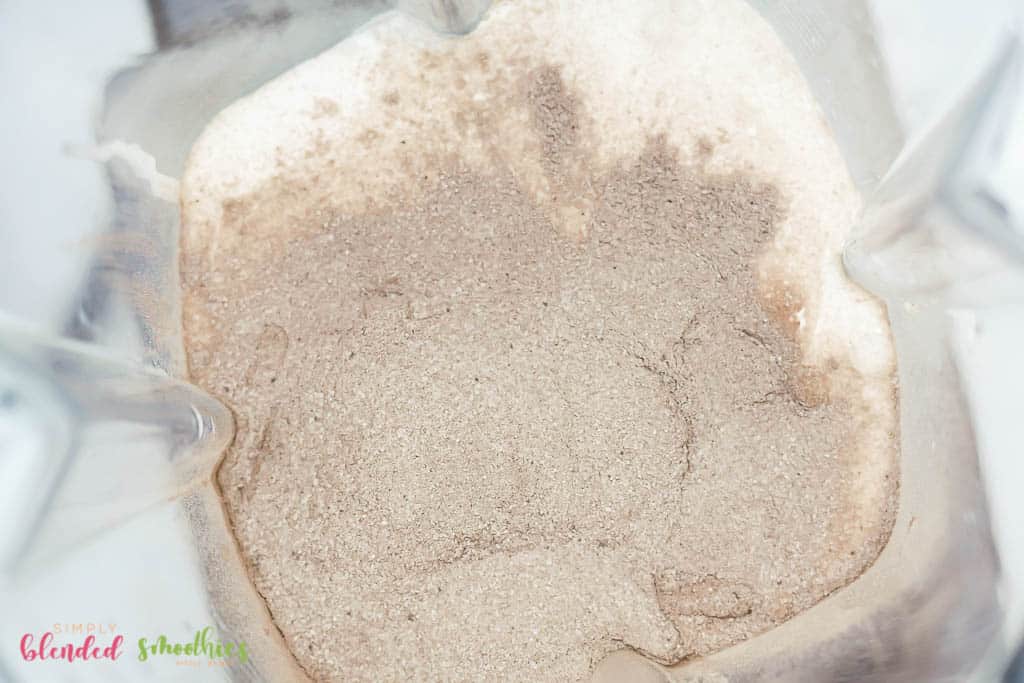 Cream And Hot Cocoa Powder In Blender Looking From The Top Down