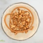 Peanut Butter Banana Smoothie with peanut butter swirl and chopped peanuts