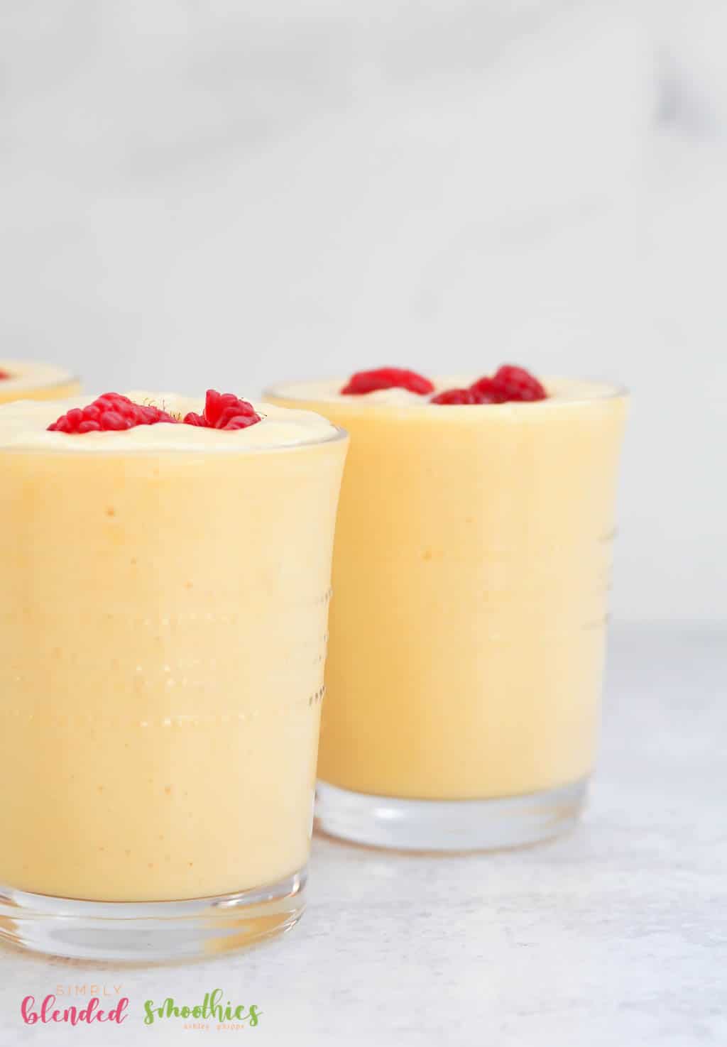 Banana Peach Smoothie With Raspberries On Top
