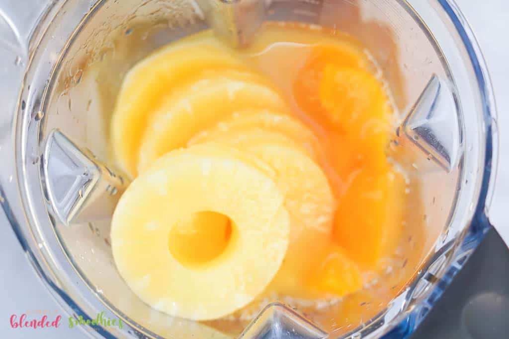 Ingredients In A Blender For A Pineapple Peach Smoothie