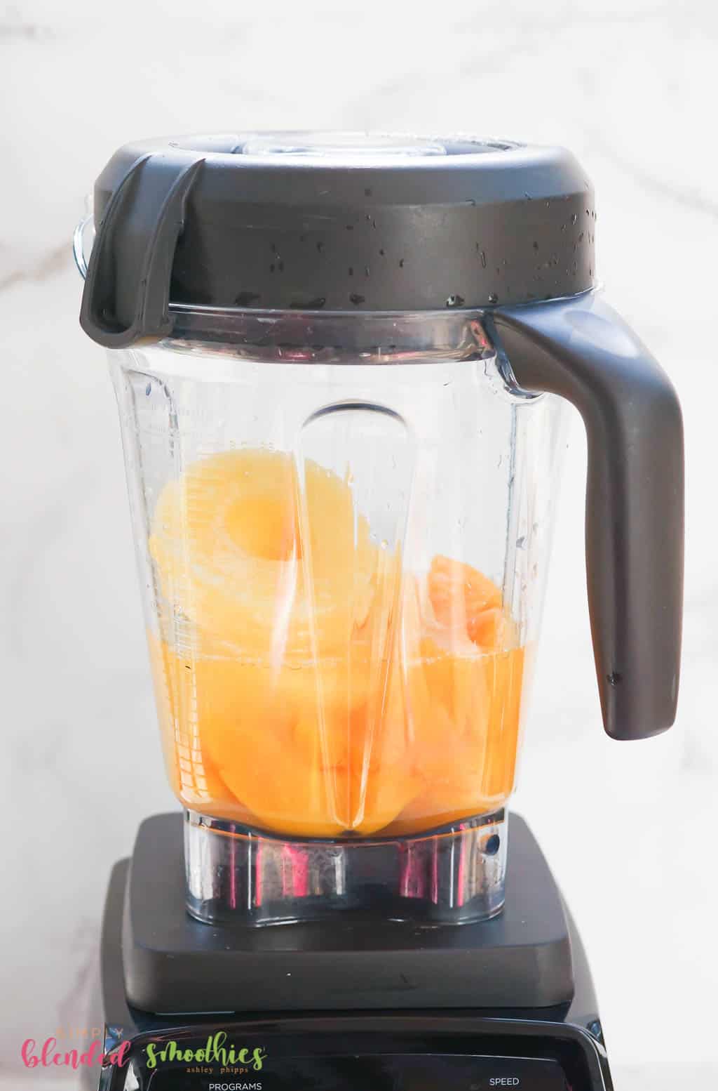 Peaches And Pineapple In A Blender For A Smoothie