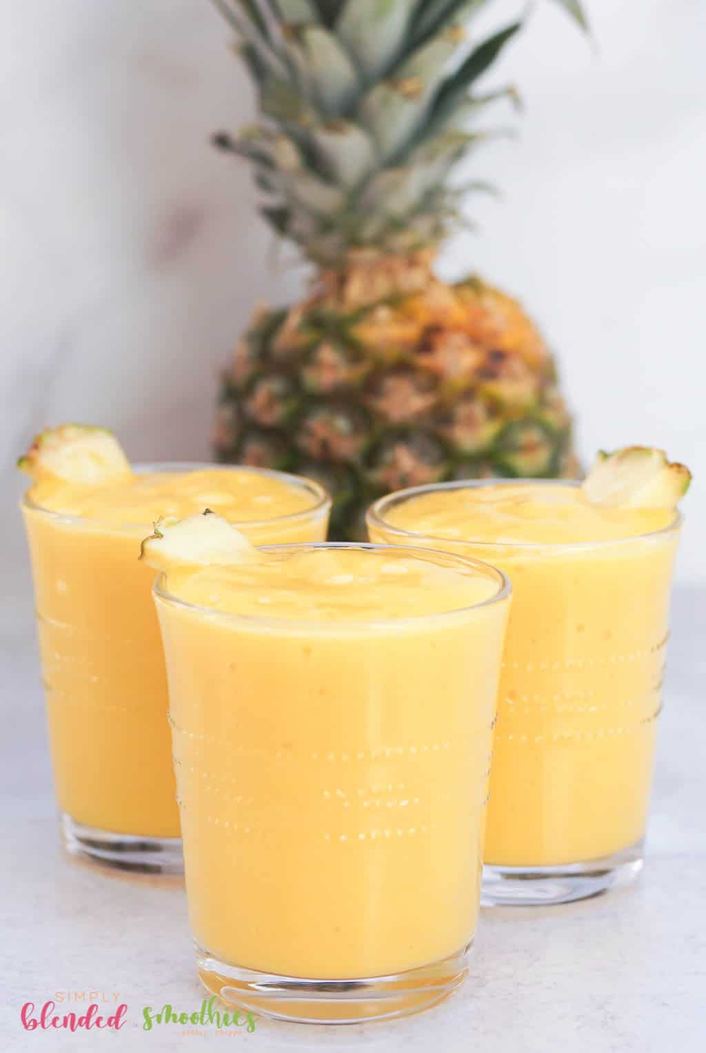 Mango Pineapple Smoothie With Pineapple In Background